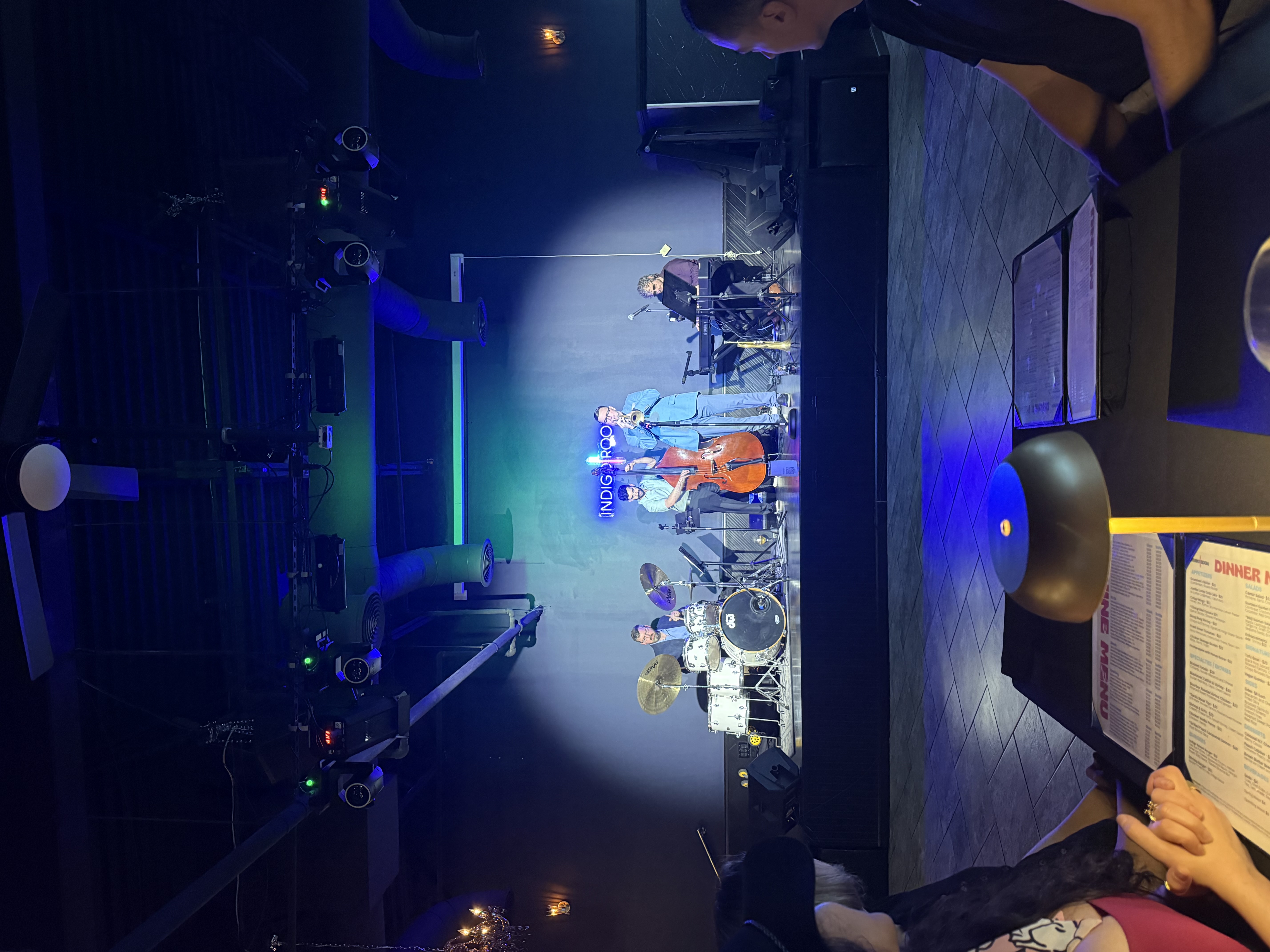 Sean McQuaid performing on a jazz club stage