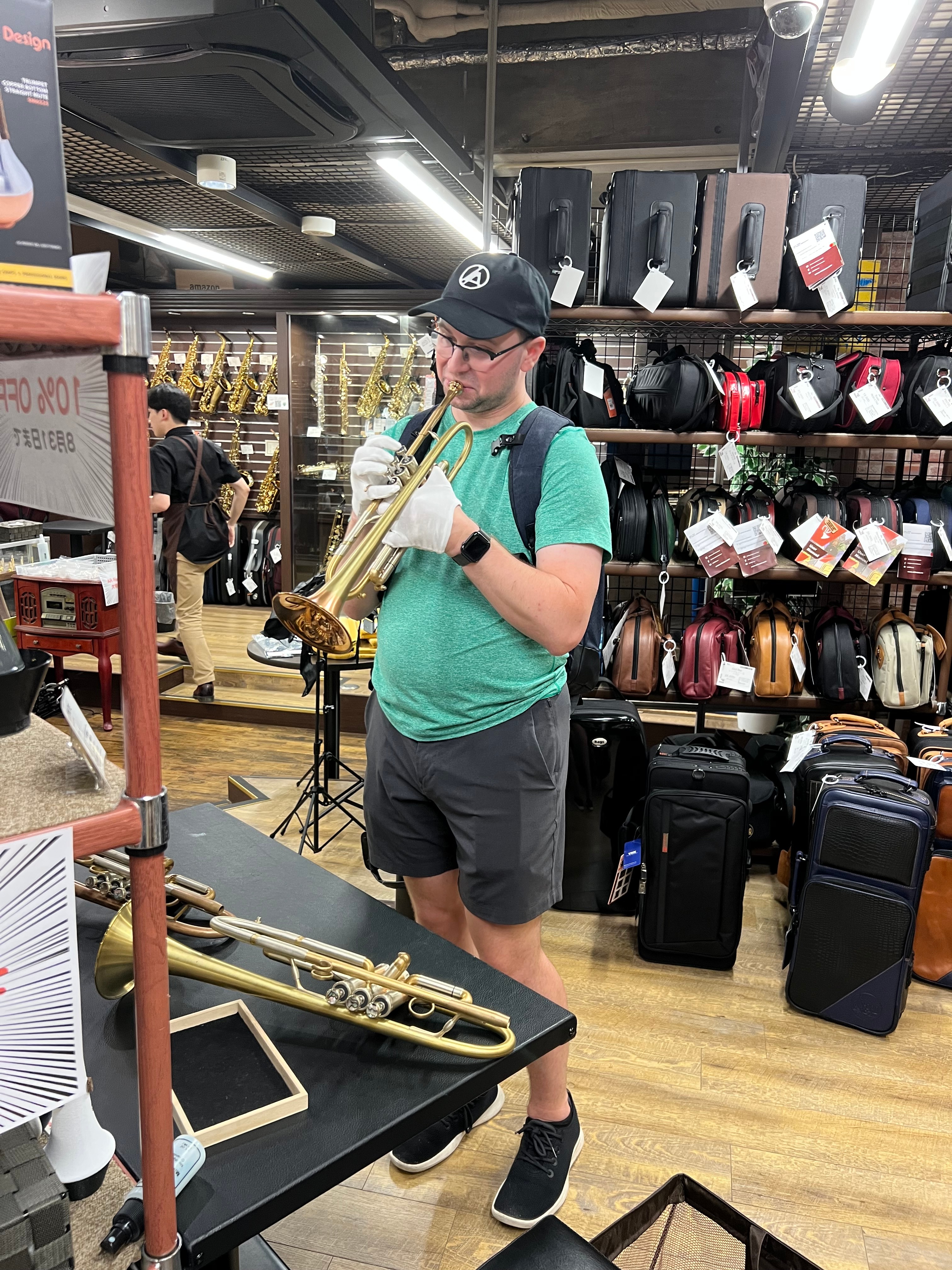 Sean testing a vintage trumpet at a music shop