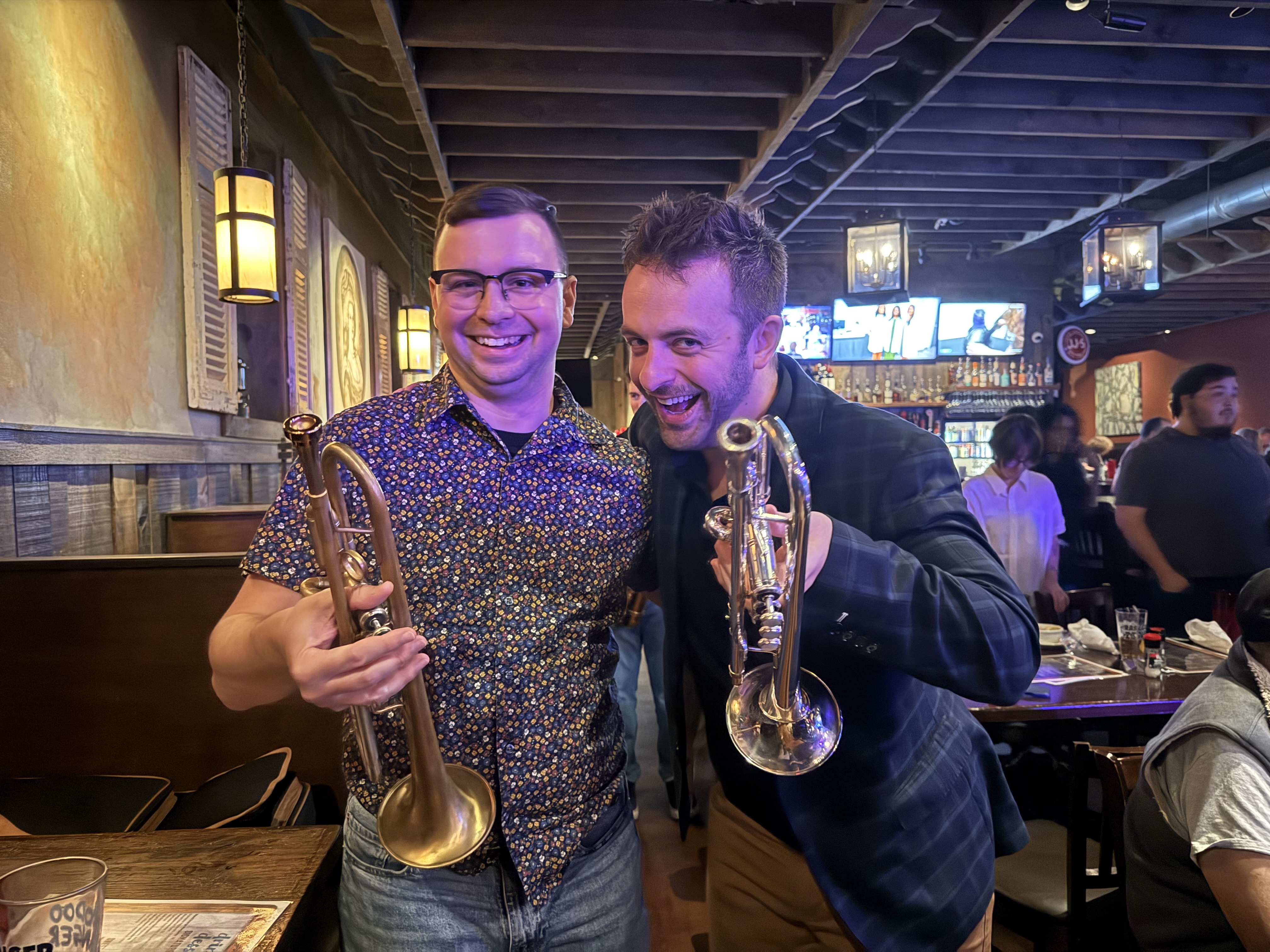 Sean sharing a laugh with a fellow trumpeter after a set